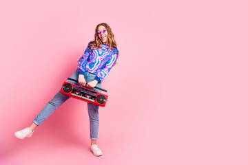 Wall Mural - Full length portrait of nice young girl boombox empty space wear sweater isolated on pink color background