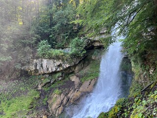 Wall Mural - Giessbach Falls in the eponymous nature park and over Lake Brienz - Giessbachfälle (Giessbachfaelle) im gleichnamigen Naturpark und über dem Brienzersee-Canton of Bern, Switzerland (Schweiz)