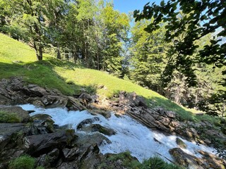 Wall Mural - Giessbach Falls in the eponymous nature park and over Lake Brienz - Giessbachfälle (Giessbachfaelle) im gleichnamigen Naturpark und über dem Brienzersee-Canton of Bern, Switzerland (Schweiz)