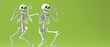 © Nathamanee - Two skeletons are dancing on a green background