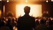 © KYR - Leadership in action: silhouette of a speaker in a conference room, with a blurred audience, representing growth, development