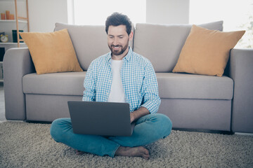 Canvas Print - Photo of handsome bearded alone mature age adult man staying home working remote web developer using laptop coding