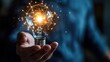 © Business Pics - Businessman hand holding creative light bulb with industry network,analysis solution and development marketing network icons planning strategy,