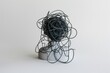 © Alena - A black ball of yarn sits alone on a table, awaiting use