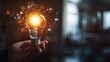 © Johannes - Businessman hand holding creative light bulb with industry network,analysis solution and development marketing network icons planning strategy,