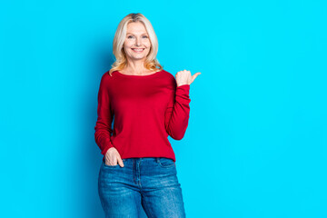 Canvas Print - Photo portrait of lovely pensioner lady point empty space dressed stylish red garment isolated on blue color background