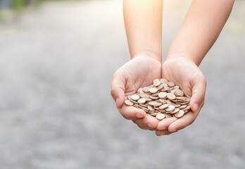 Hands holding a handful of coins