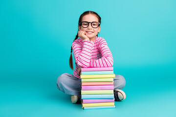 Sticker - Photo of cute pretty sweet girl wear trendy pink clothes sit floor hold book isolated on cyan color background