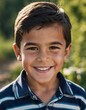 © Iuliia - A smiling Tajik boy 5 years old beams with happiness, enjoying the beauty of a sunny day outdoors. His cheerful expression reflects moment of pure joy and innocence. Happy smiling child. AI generated