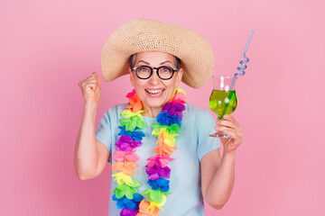 Sticker - Photo of pretty aged woman cocktail glass raise fist isolated on pink color background