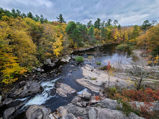 Beautiful autumn river scenery at McCrae Lake Waterfall, Canada.