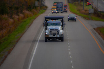 Heavy truck on a Canadian highway in the fall in Quebec