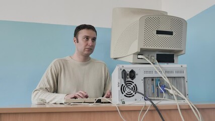 Tired Programmer Is Working On Old Style 1980S 1990S Computer In Office
