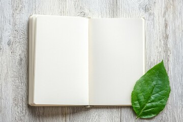 A blank notebook is placed on a wood table decorated for Christmas