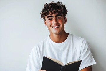 An isolated picture of a young teacher holding a book