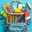 © Yevheniia - School supplies like a backpack, books, pens, notebooks, and other study items on a blue-turquoise background, creating a back-to-school atmosphere. Suitable for educational materials and advertisemen