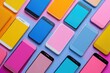 © Lubos Chlubny - Many colorful smartphones lying on colorful background with blank screen