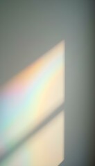 Wall Mural - light reflection through a prism, creating a spectrum of colors on a white wall with a focus on the 