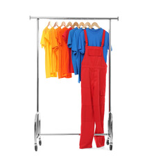 Canvas Print - Worker's uniform and t-shirts on clothing rack isolated on white