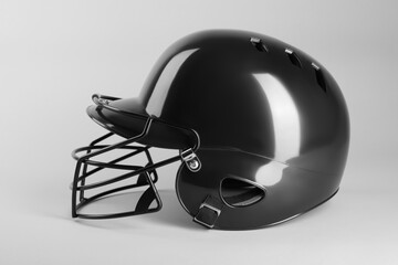 Poster - One black baseball helmet on white background