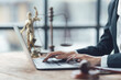 © Kritdanai - Legal Professional Working on Laptop