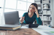 © Kritdanai - Stressed Businesswoman at Desk