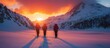 © GoDress - Three hikers with backpacks and trekking poles walk in the snow-covered valley of the mountains, as the setting sun paints the sky with vibrant colors.