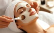 © chusnul - A woman receiving a facial treatment at a spa, enhancing relaxation and skincare.