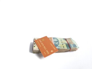 Rupiah banknotes and credit cards on a white background