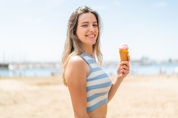 Poster - Young pretty woman with a cornet ice cream at outdoors smiling a lot