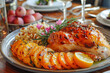 © João Macedo - Delicious roasted chicken with slices of orange for thanksgiving dinner being served on a table