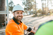 © Austockphoto - Closeup of a construction worker sitting on the ground of the construction site.