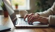 © Shams - Digital Workspace: A person's hands typing diligently on a laptop keyboard, capturing the focus and productivity in a contemporary home office. The scene conveys modern work style, efficiency.
