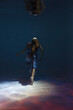 © Сергей Луговский - Young woman in dress underwater from back