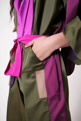 Fashionable robe with vibrant purple and olive green colors, ideal for lifestyle and apparel showcases.