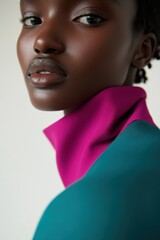 Poster - Stylish Portrait: A Close-Up of a Model in Turquoise and Magenta Attire, Suitable for Fashion Campaigns