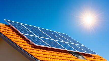 Clear blue sky above a UK house roof equipped with solar panels capturing sunlight. Renewable energy integration concept