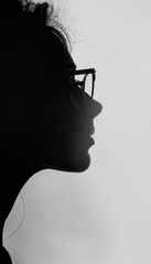 Leinwandbilder - A profile silhouette of an individual with eyeglasses is gently illuminated, creating a calm atmosphere in the background. Generative AI