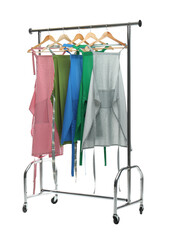 Canvas Print - Chef's aprons on clothing rack isolated on white