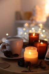 Canvas Print - Burning candles, coffee and decor on tray indoors, closeup. Autumn atmosphere