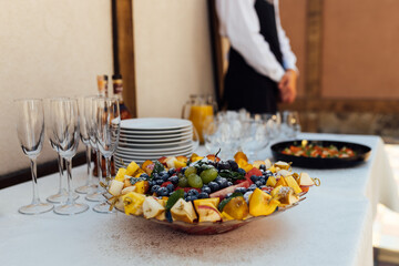 Wedding party. Buffet table with vegetables and fruits.