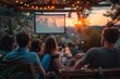 © Dm - Open air cinema. Backyard Family outdoor movie night. DIY Screen with film. Summer outdoor weekend. Relaxing with a group of friends