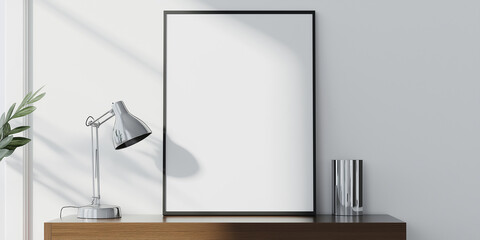 Poster - Empty frame leaning on white wall with lamp on desk
