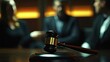 © Nuttaya Nampai - Lawyers Discussing Case with Gavel in Foreground