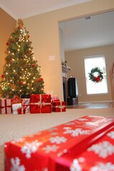 a christmas tree and presents in a living room