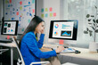 © PaeGAG - Young professional is suffering from a headache while reviewing marketing data on her computer and documents at her workstation
