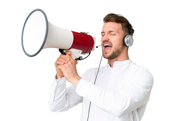 Canvas Print - Telemarketer caucasian man working with a headset over isolated chroma key background shouting through a megaphone