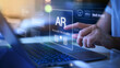 © FAQIR - businessman using a laptop with a virtual interface of AR, augmented reality concept, virtual decor, AR home decor, 3d design,AR technology