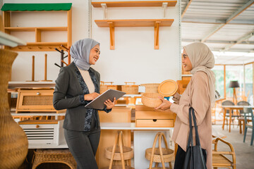 In a chic and modern office environment, two women are having a deep and meaningful conversation