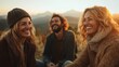 © JoxyAimages - Three friends laugh together surrounded by a scenic mountain view at sunset. This image captures the joy of companionship in a breathtaking natural environment.